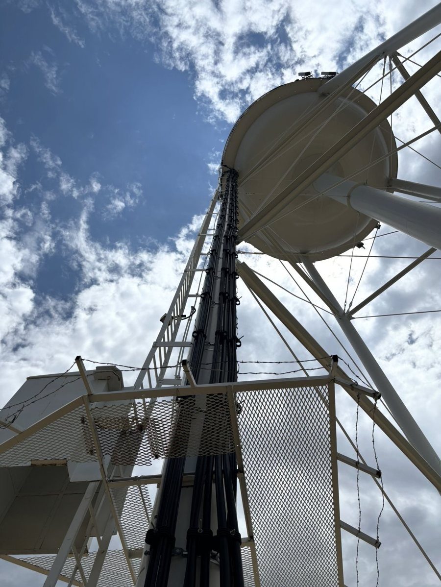 Looking up an elevated water tank leg with AMI cabling running to the bowl
